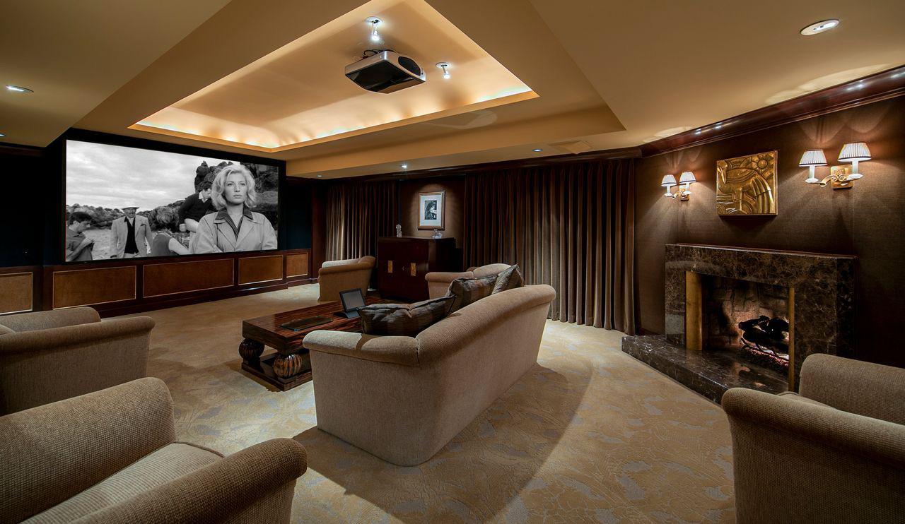 Lebron James luxury estate featuring a tennis court, swimming pool, living room, and home theater