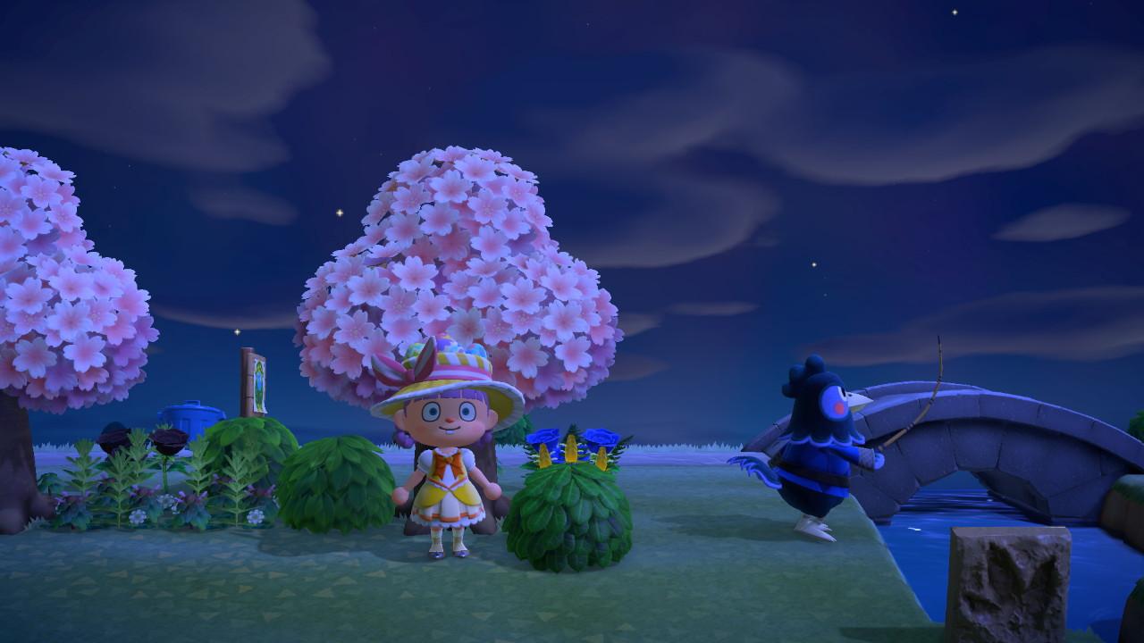 Animal Crossing: New Horizons character in a yellow floral dress and wide-brimmed hat by a bridge with cherry blossom trees