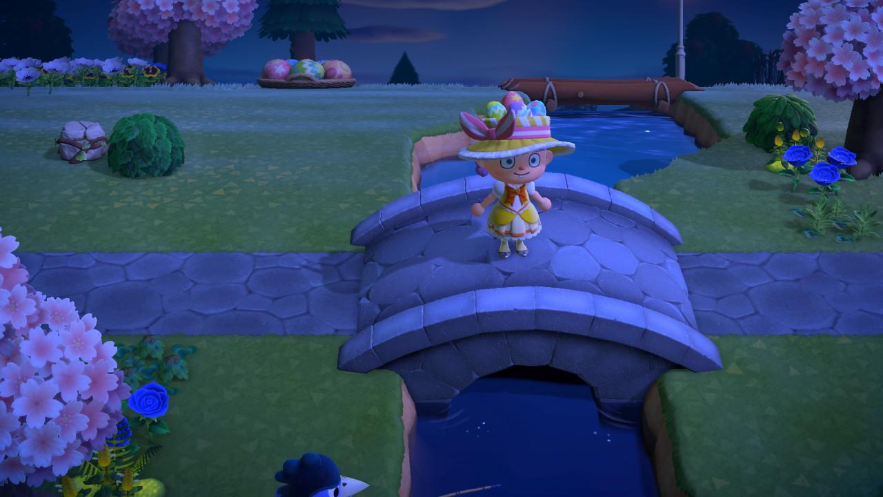 Animal Crossing: New Horizons character in a yellow floral dress and wide-brimmed hat by a bridge with cherry blossom trees