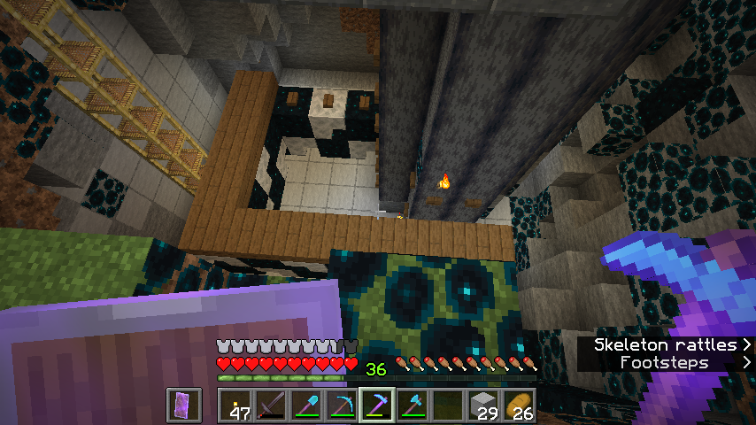 Minecraft survival builds featuring a diamond pickaxe in an underground room and a tall stone tower