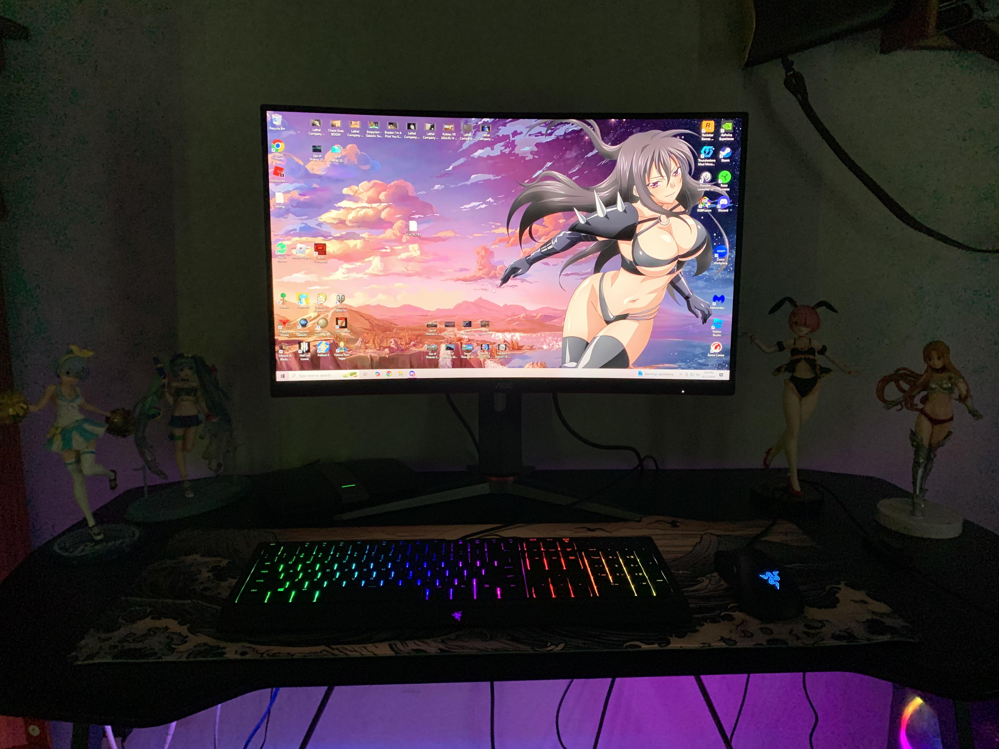 Hatsune Miku anime figures and gaming pc desk setup with LED display cases