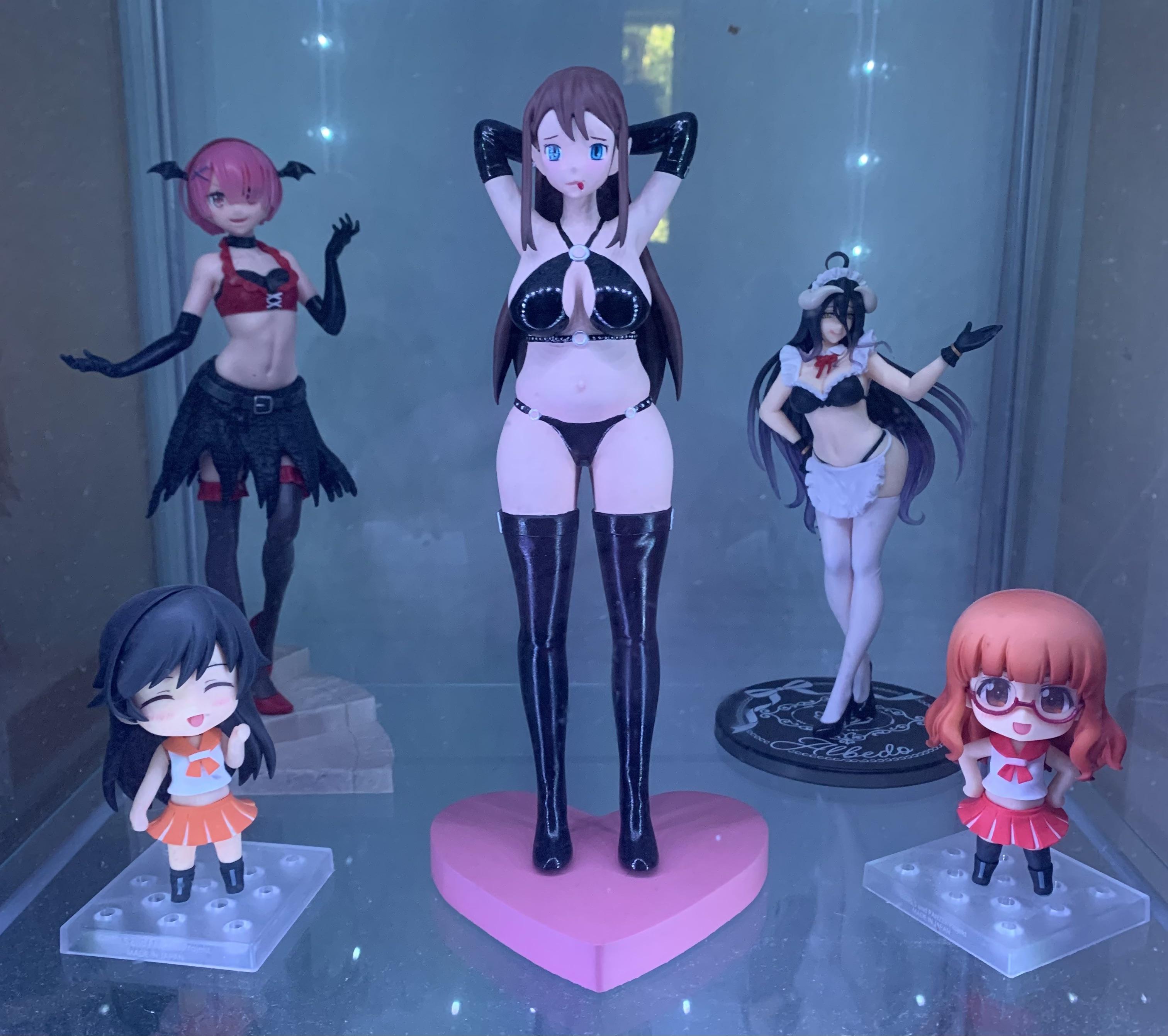 Hatsune Miku anime figures and gaming pc desk setup with LED display cases