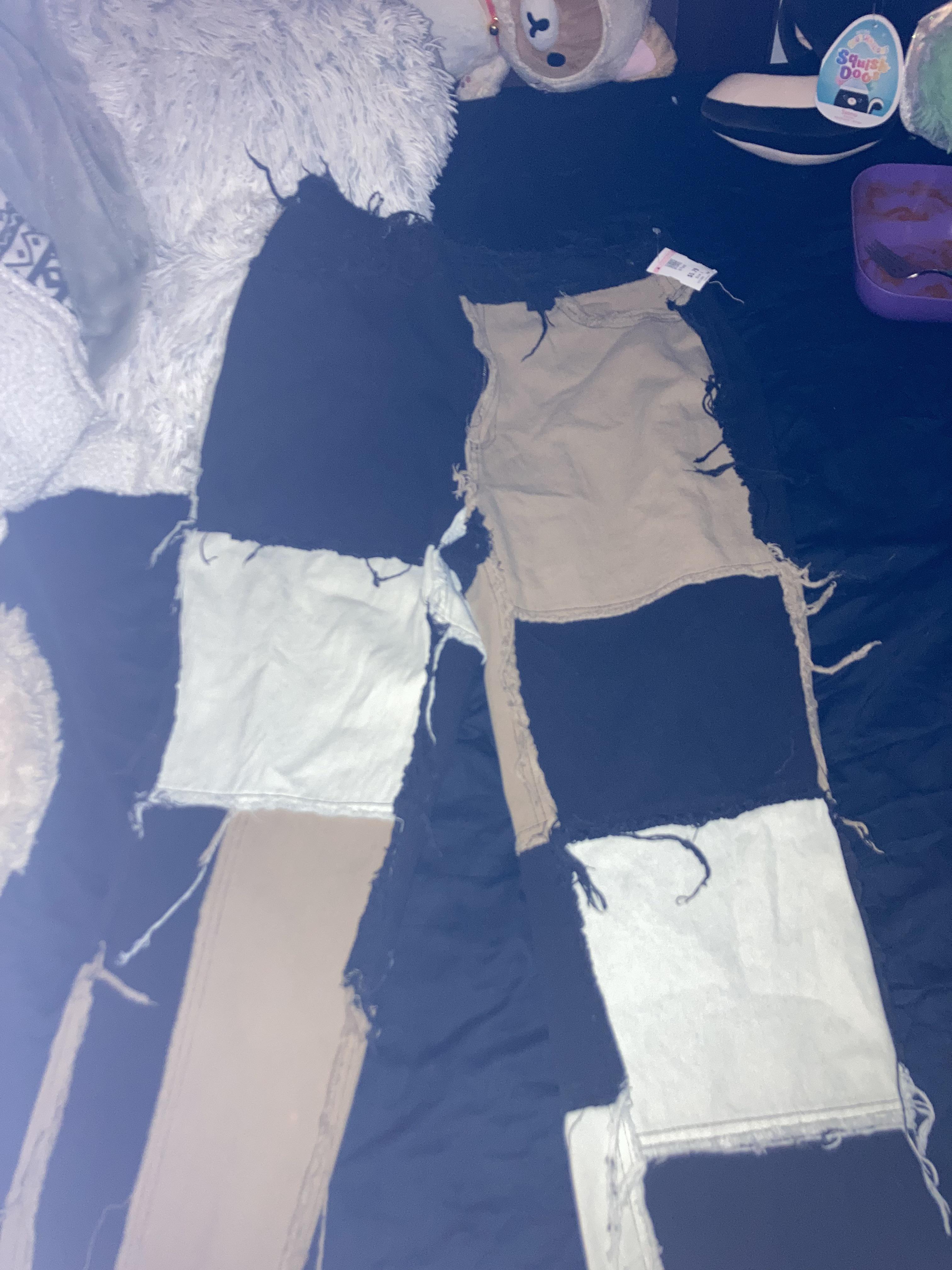 Thrift haul featuring a Hello Kitty tank top, sunflower white shirt, pink tutu top, and a striped turtleneck
