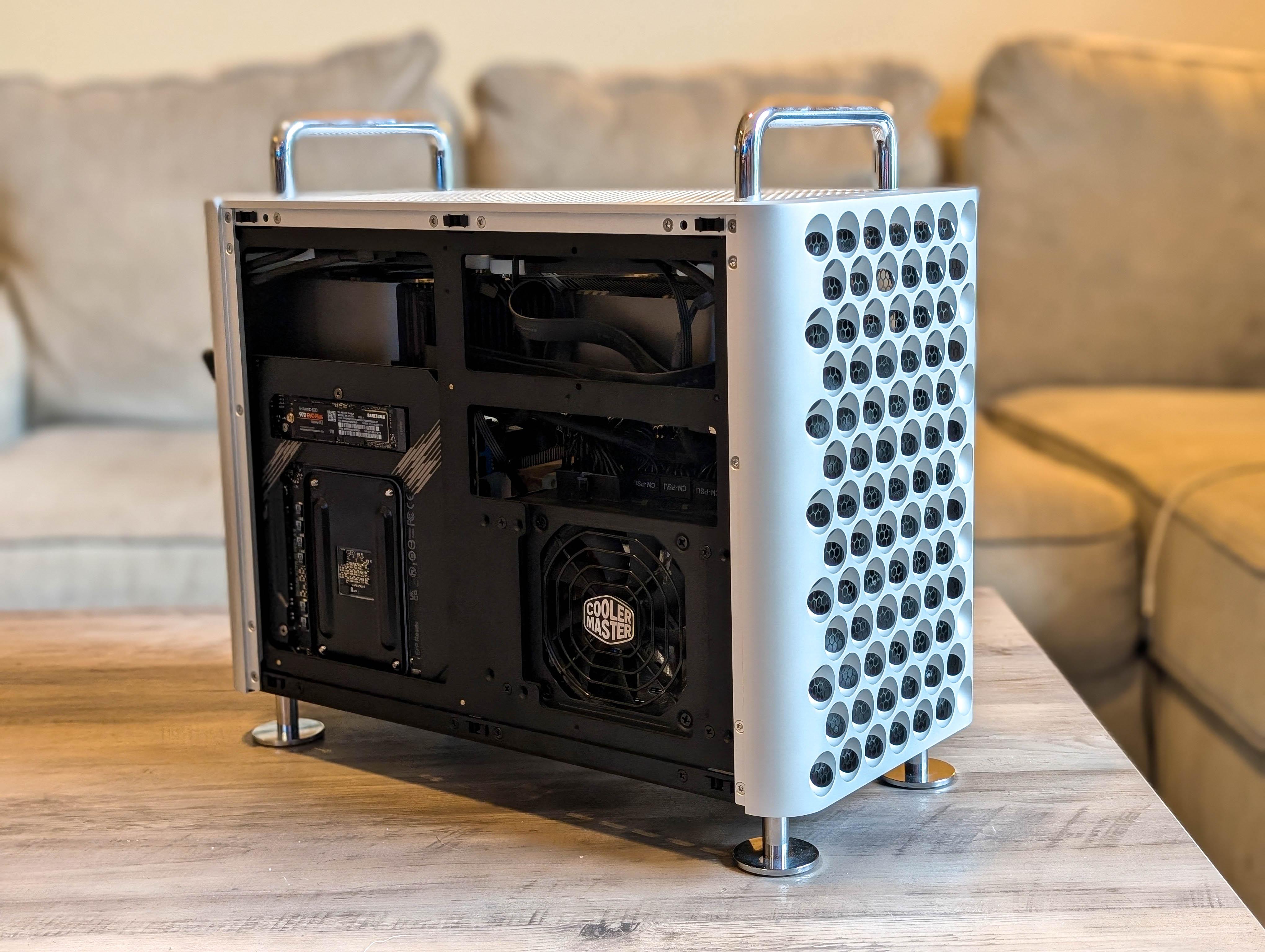 McPrue Apollo S v3 white compact custom gaming PC build on a desk with monitors, keyboard, and headphones