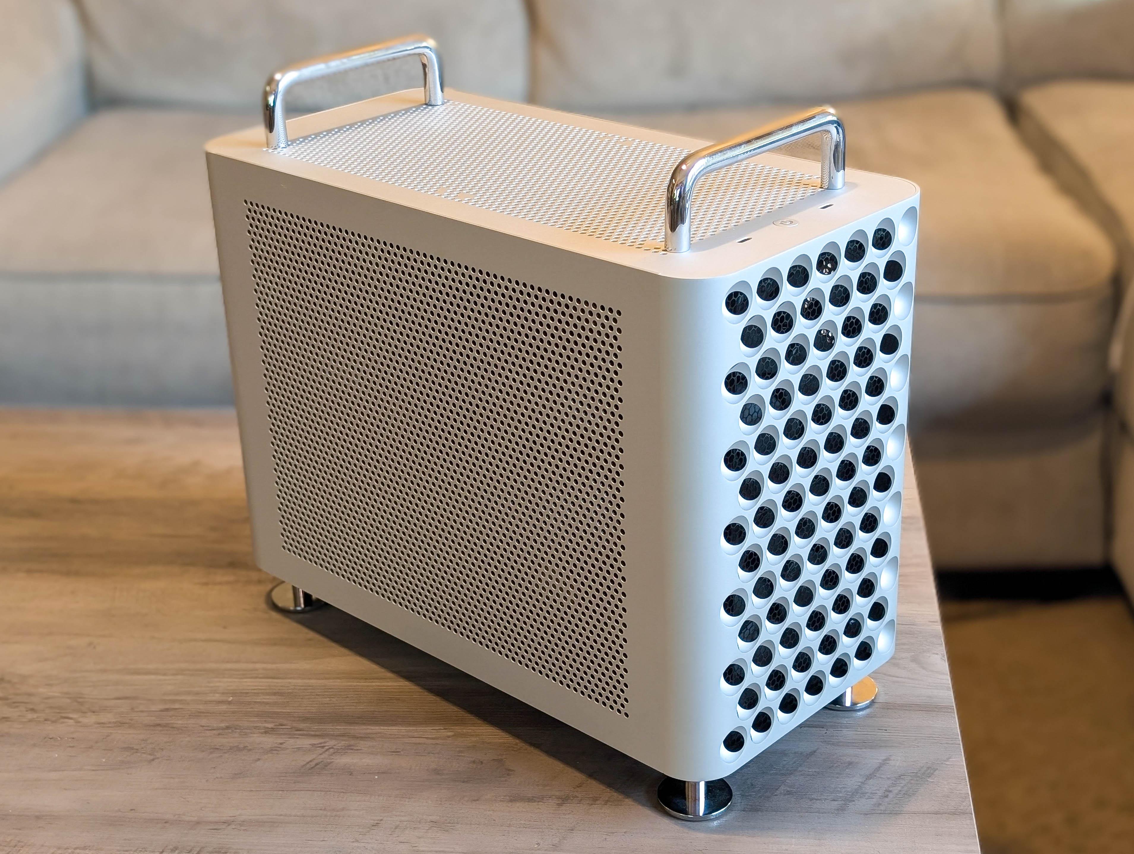 McPrue Apollo S v3 white compact custom gaming PC build on a desk with monitors, keyboard, and headphones