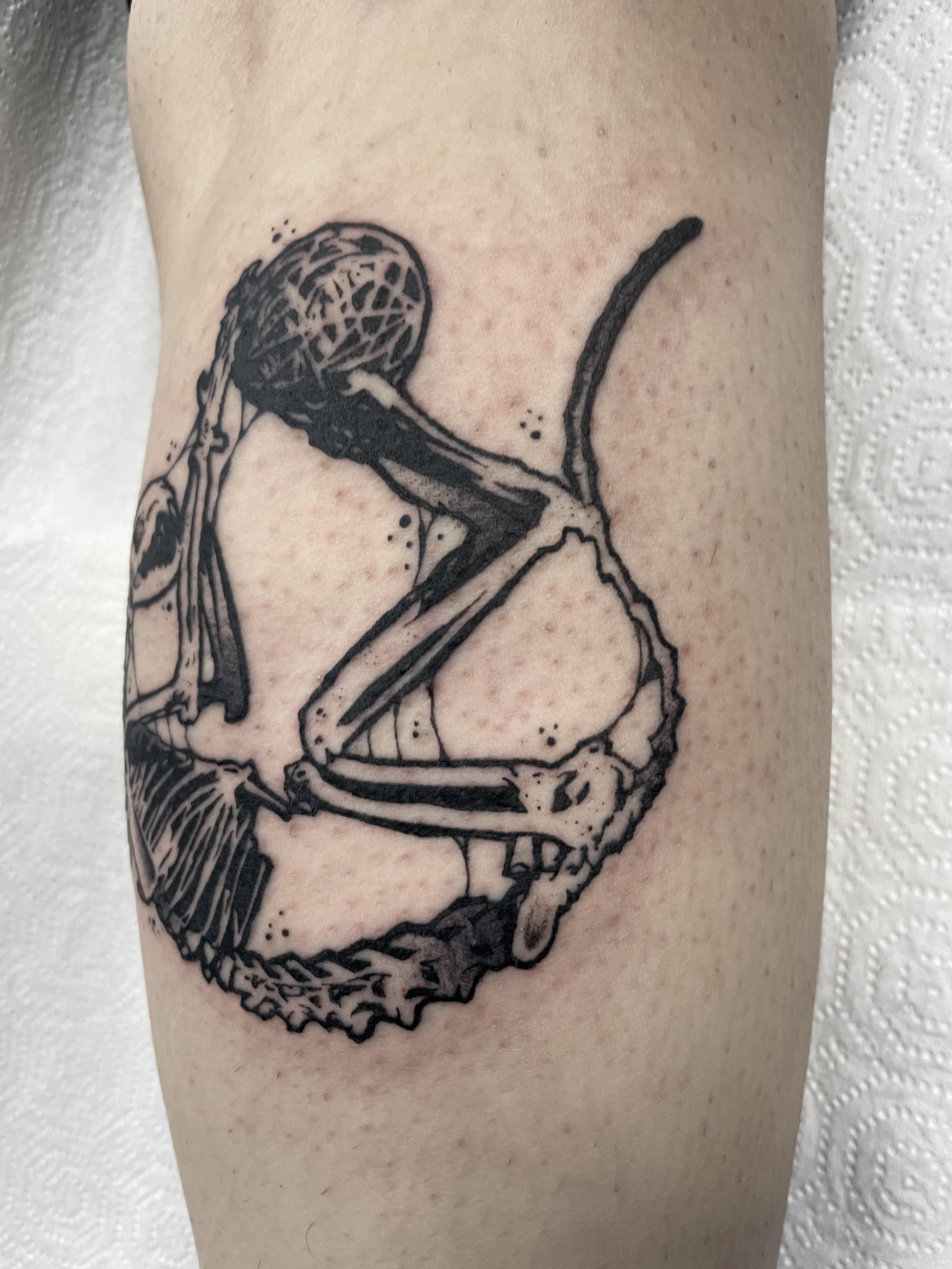Cat skeleton tattoo by @johnnyxlit on a person's fair skin leg