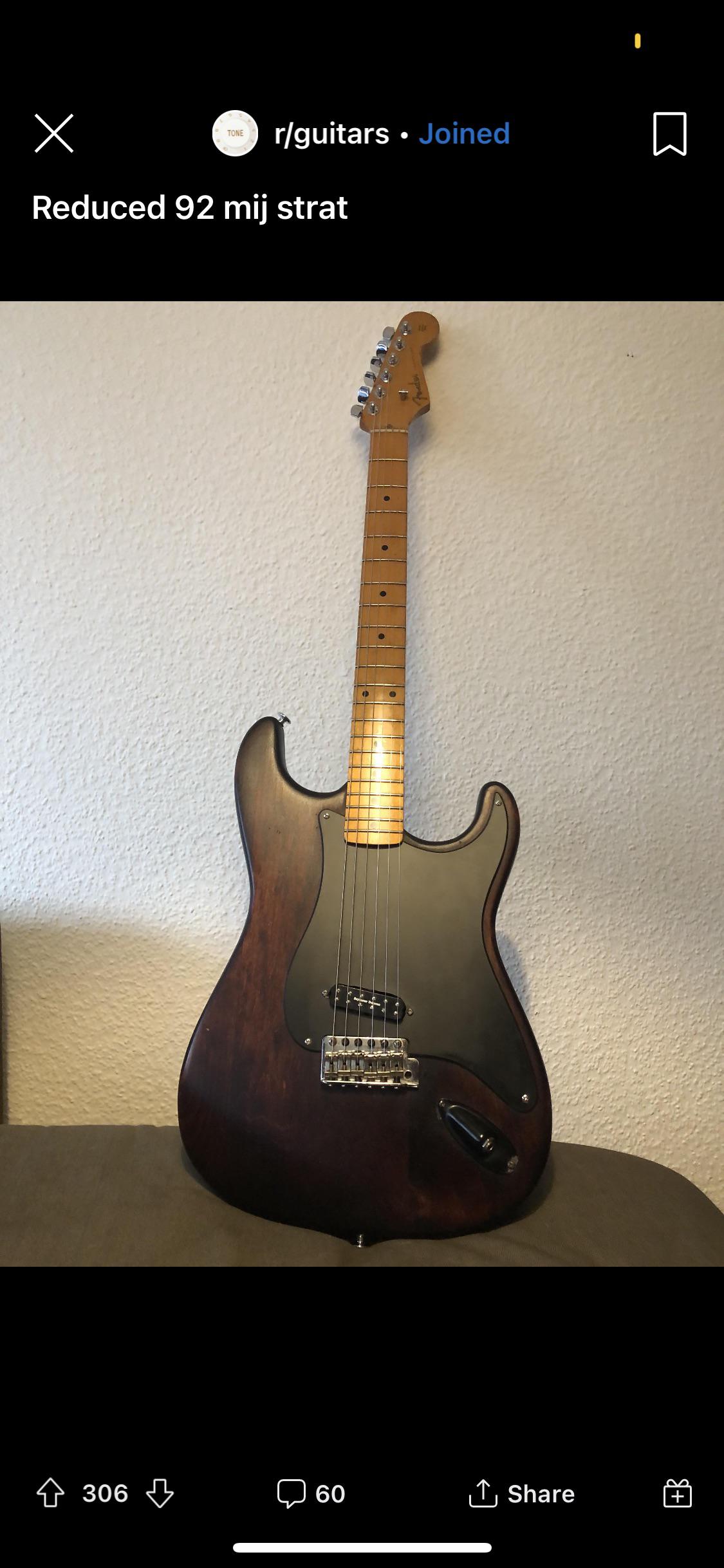 Reddit post from r/guitarcirclejerk showing a modified 1992 Fender Stratocaster with a penis or large clitoris shape.