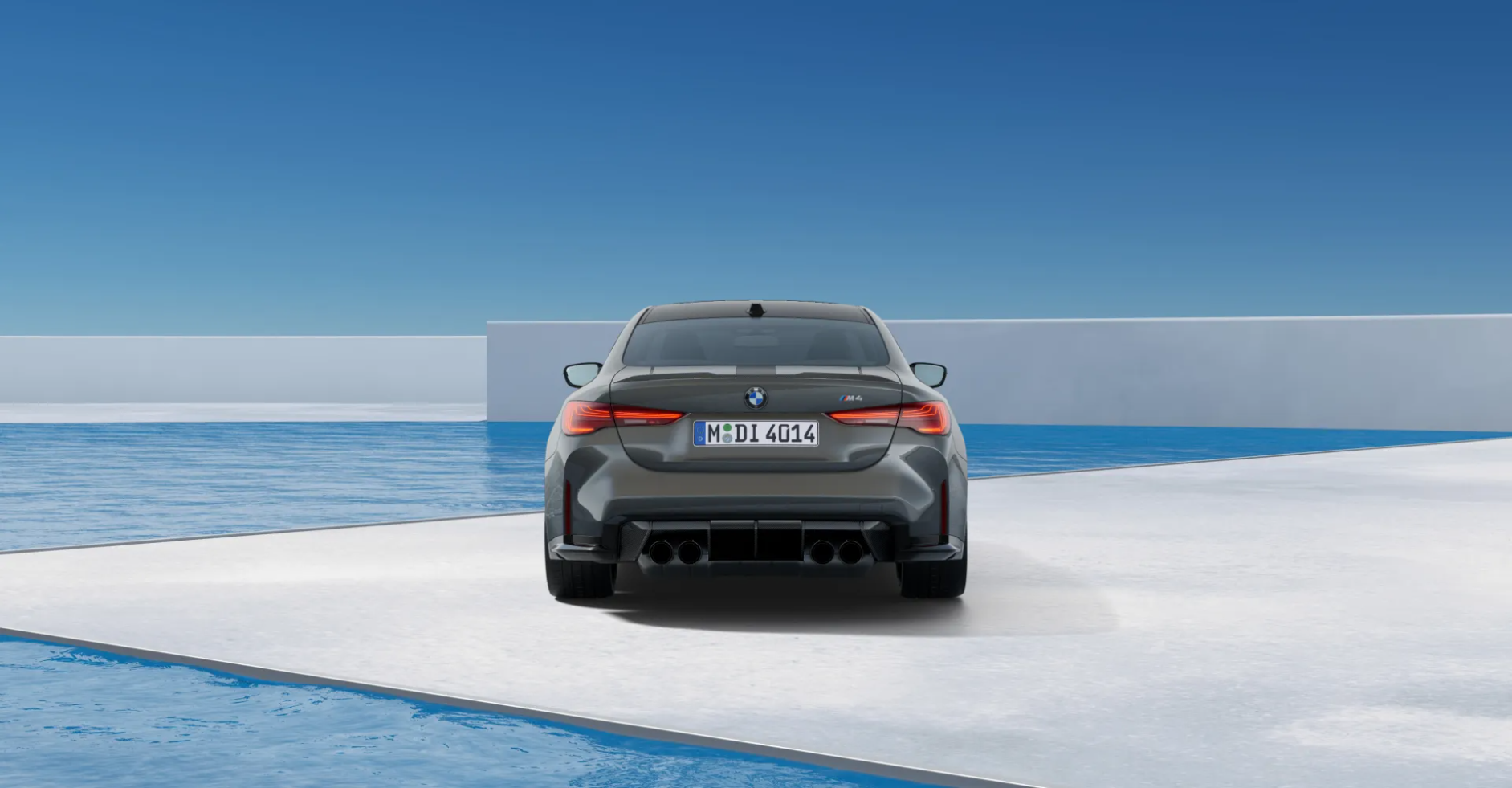 Grey BMW M8 coupe in a minimalist white architectural space by the ocean
