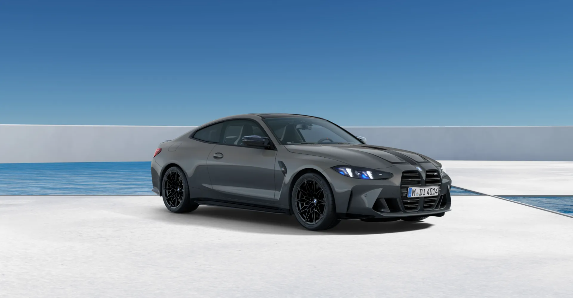 Grey BMW M8 coupe in a minimalist white architectural space by the ocean
