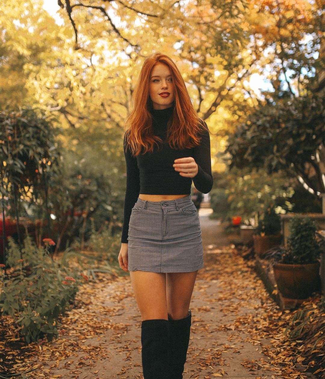 Riley Rasmussen, a redheaded goddess, in a bikini, blouse and skirt, turtleneck, and denim shirt.
