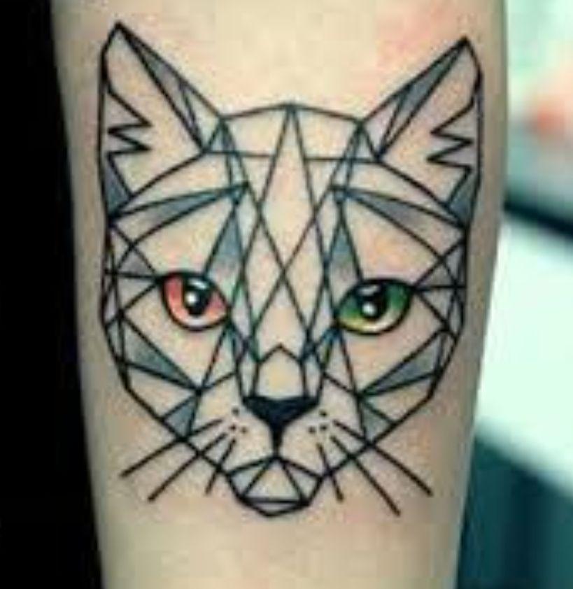 Geometric cat tattoos on light skin, featuring fine line tattoo inspiration and abstract animal drawings.