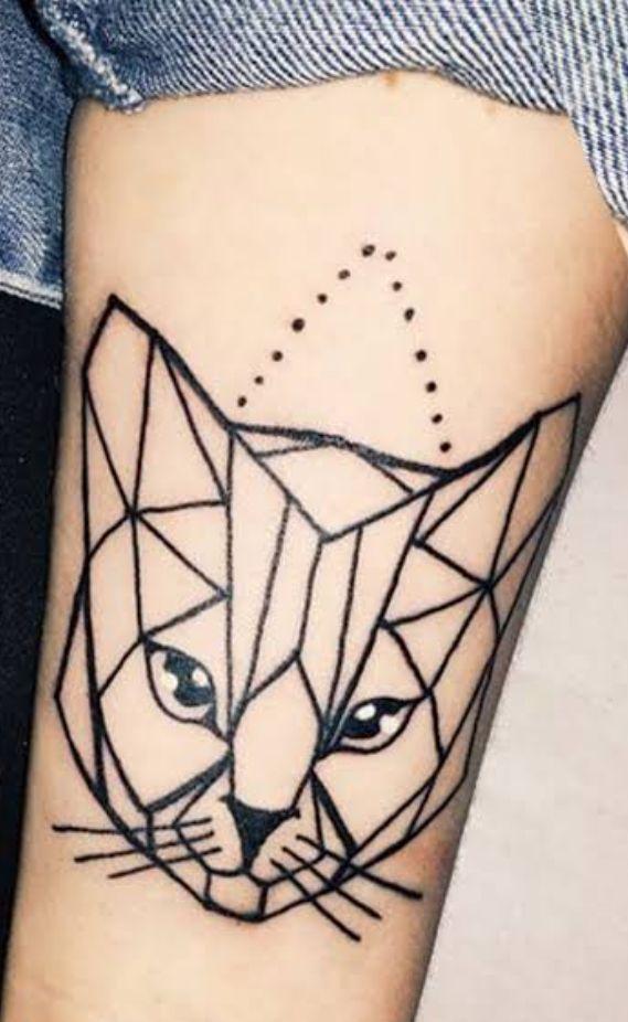 Geometric cat tattoos on light skin, featuring fine line tattoo inspiration and abstract animal drawings.