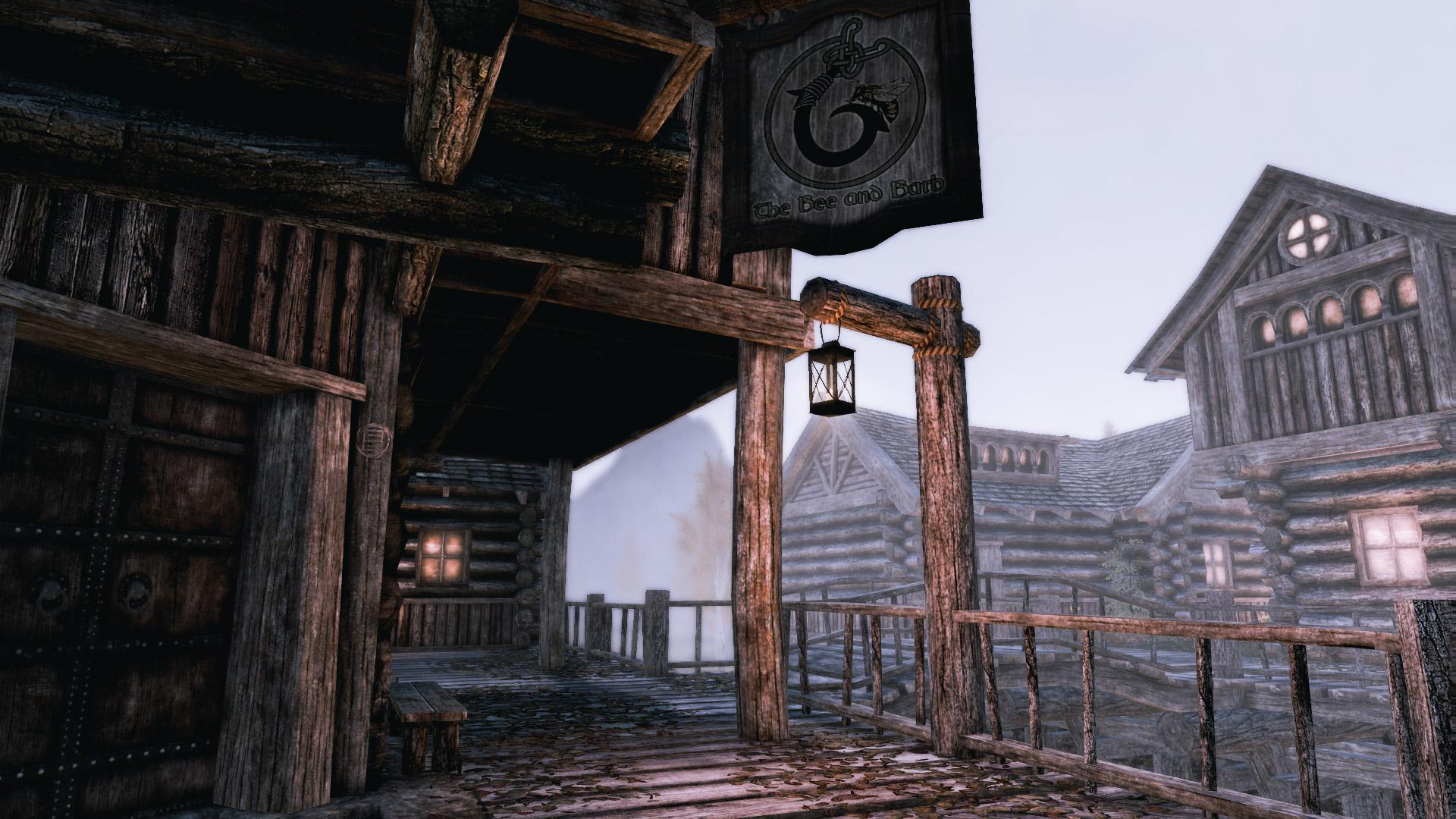Skyrim medieval build featuring rustic wooden buildings, a bridge, and glowing lanterns at night