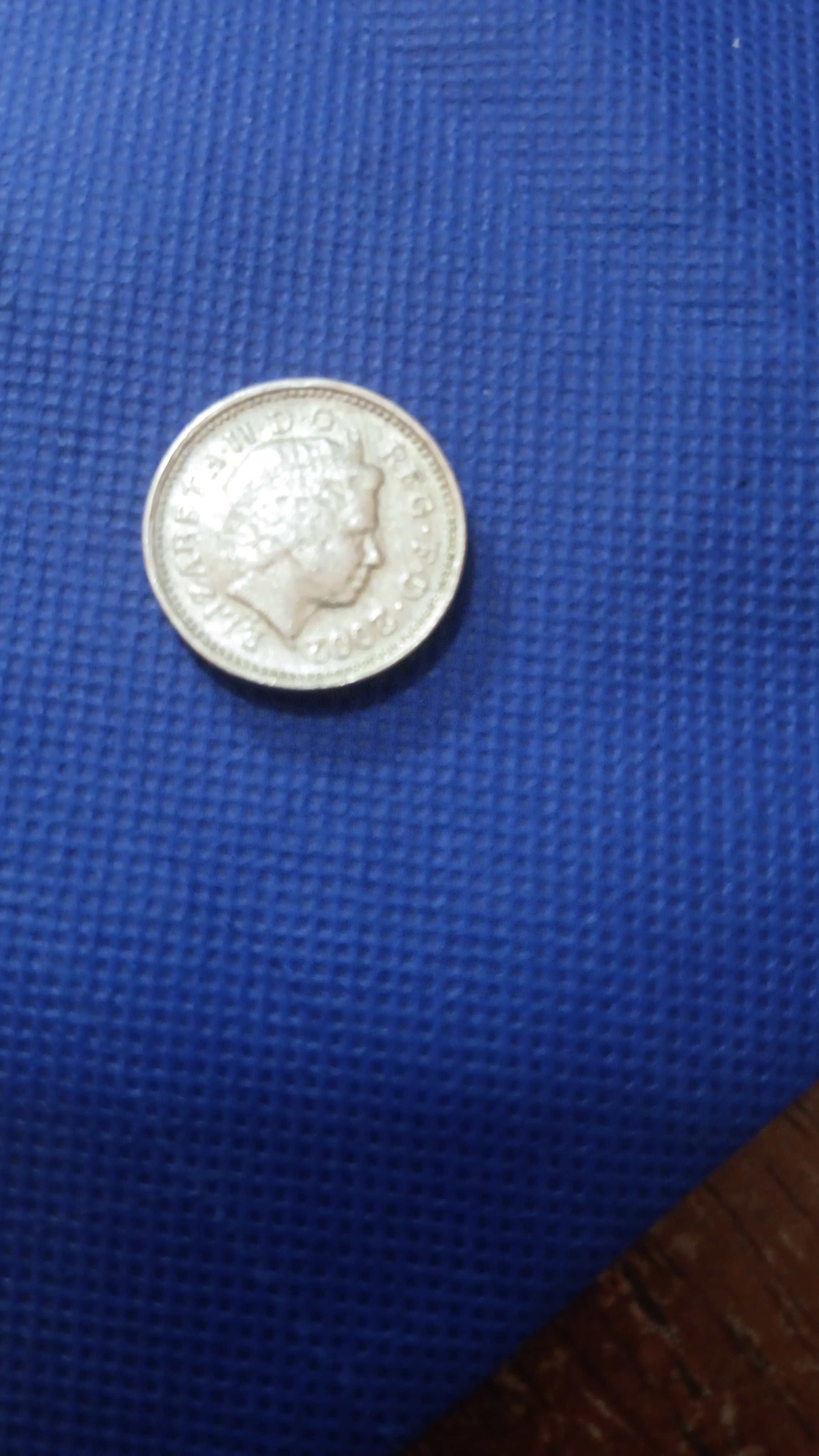 2003 one pound lettering on edge is upside down amd missing letters it ...