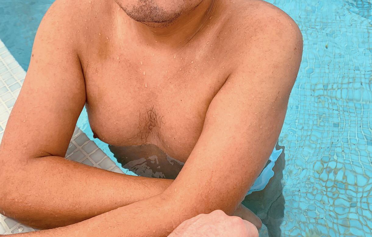Thicc mature man with a dad bod posing in white briefs at a pool and beach