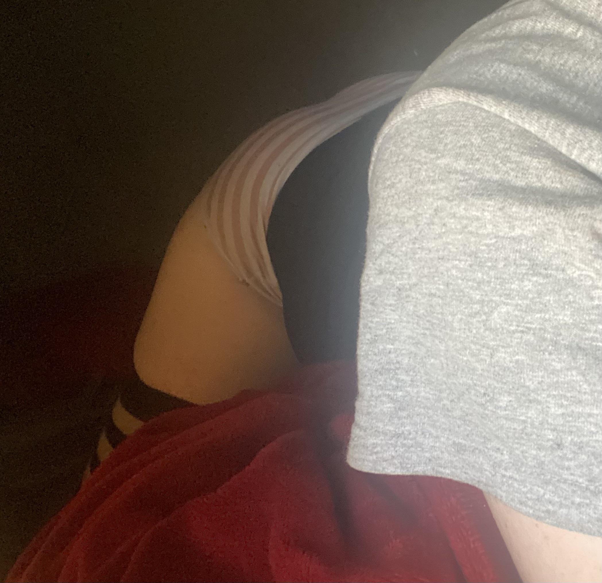 Curvy white sissy in striped lingerie and stockings posing to show her backside in a selfie