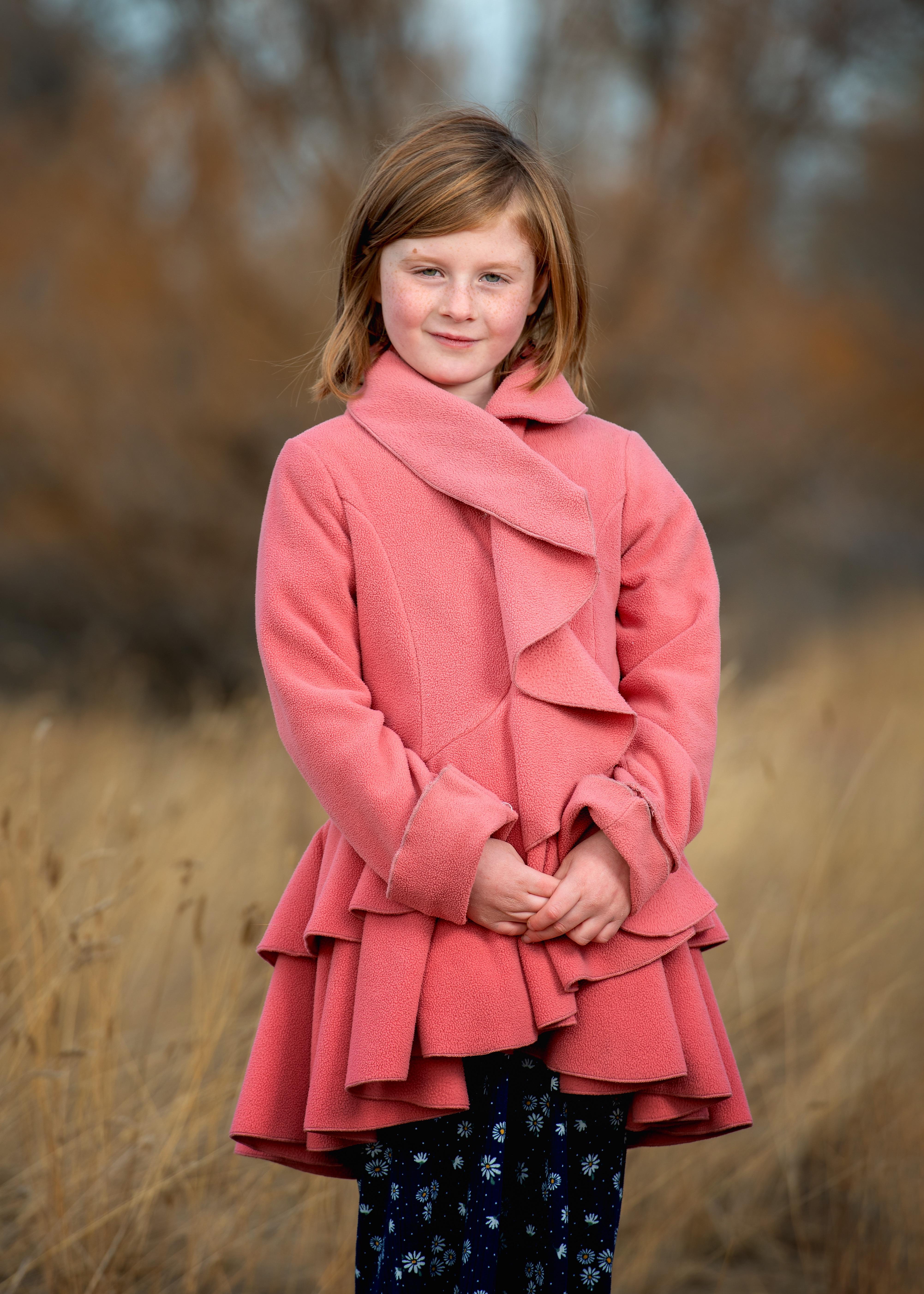 Can someone help me? I need to replace the little girl with the pink coat and blue pants in the first photo, with the second photo! Please touch up lighting. Will tip best one! Thank you!