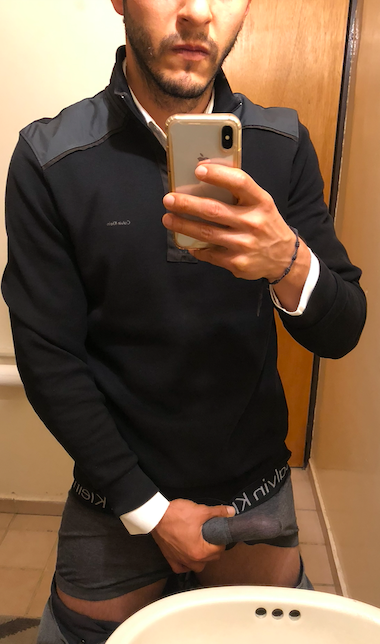 Muscular Arab DILF in Calvin Klein underwear and a white shirt posing for mirror selfies in a bathroom