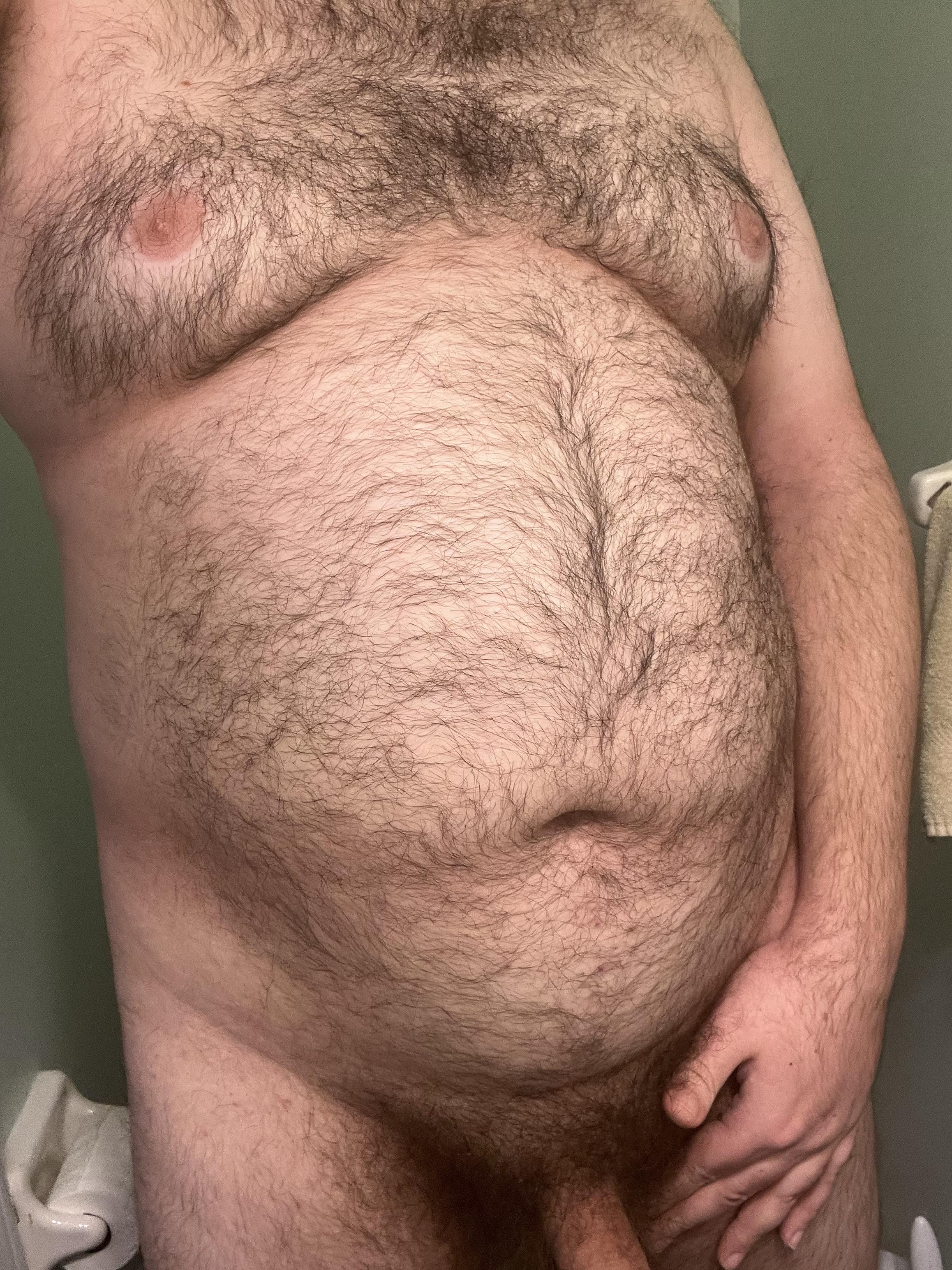 Chubby white man with a hairy dad bod posing for front and side body shots in underwear.