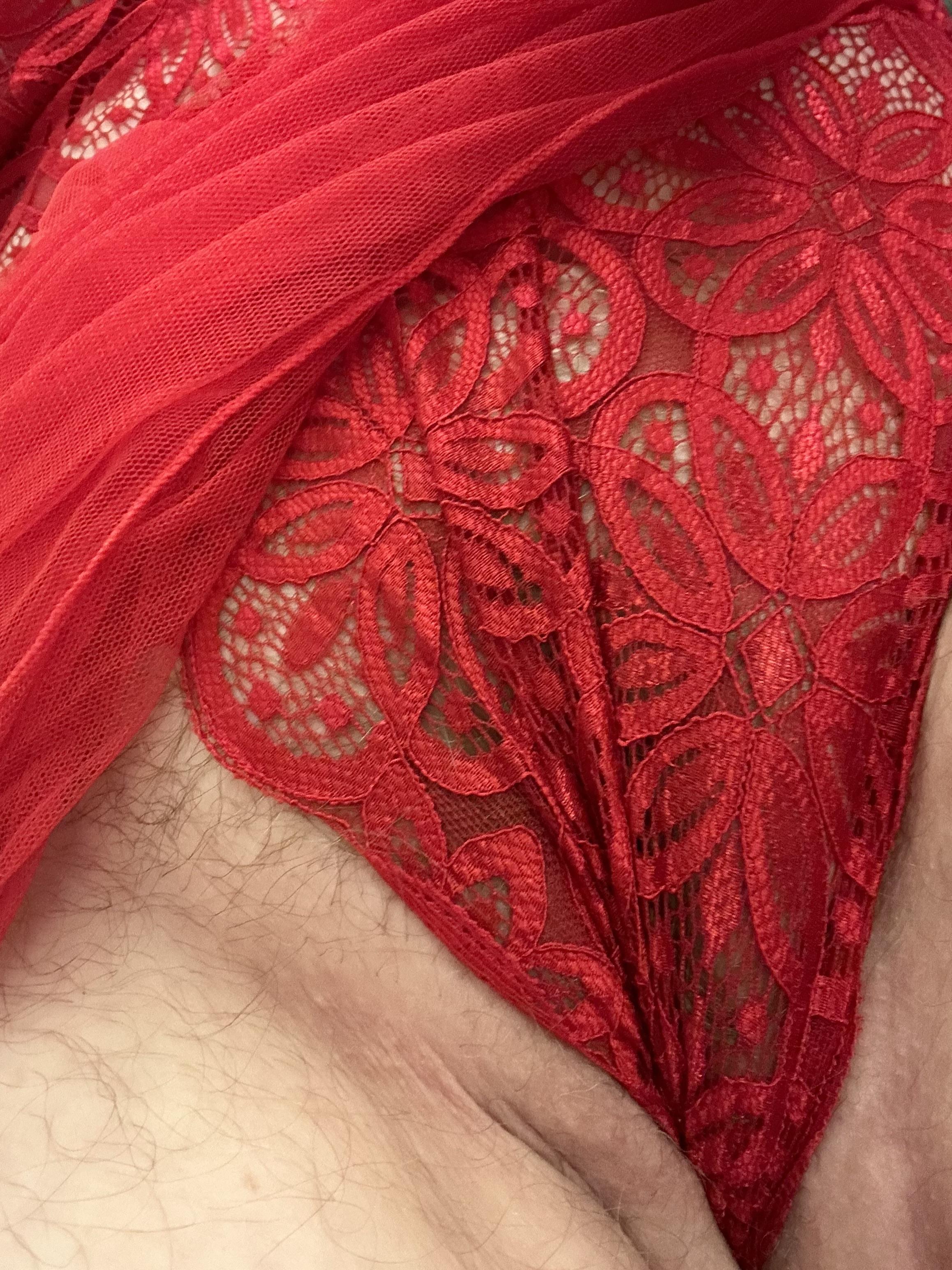 Busty blonde church wife in red lace lingerie giving a blowjob in a bedroom selfie