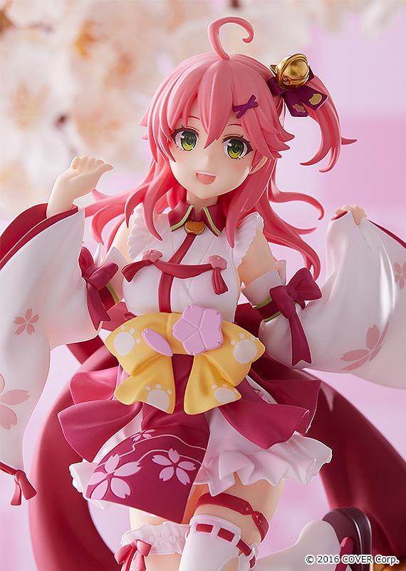 Sakura Miko anime figure with pink hair in a red and white kimono-style dress with yellow bows