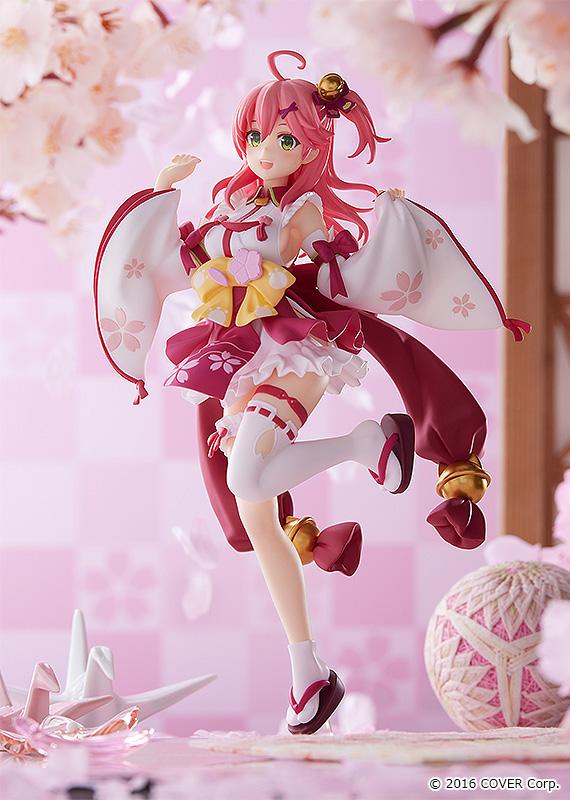 Sakura Miko anime figure with pink hair in a red and white kimono-style dress with yellow bows