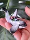 A cute little white orca I made recently, with flowers atop its back!