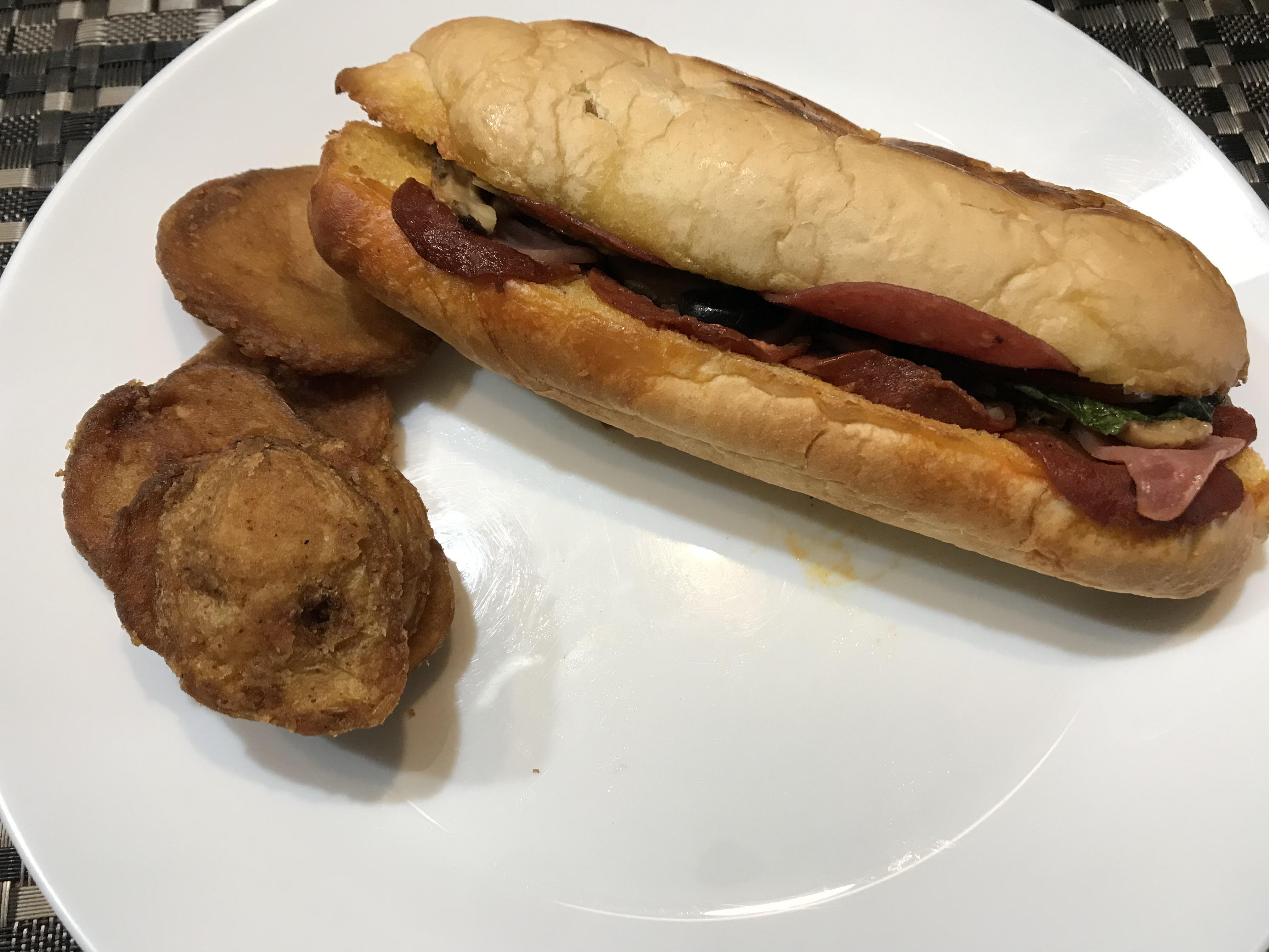 A take home on the “Classic Hero” Sandwich and a bonus potato slices ...