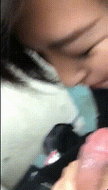 Asian cumslut in a black turtleneck kneeling to give a blowjob