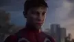 Spiderman in a red and white superhero suit staring forward with a solemn expression against a city skyline.