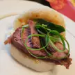 Bao w/ crispy duck, hoisin, cashews, curly spring onion and lamb's lettuce 
