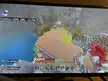 Minecraft survival builds featuring a house by mountains and water during rain