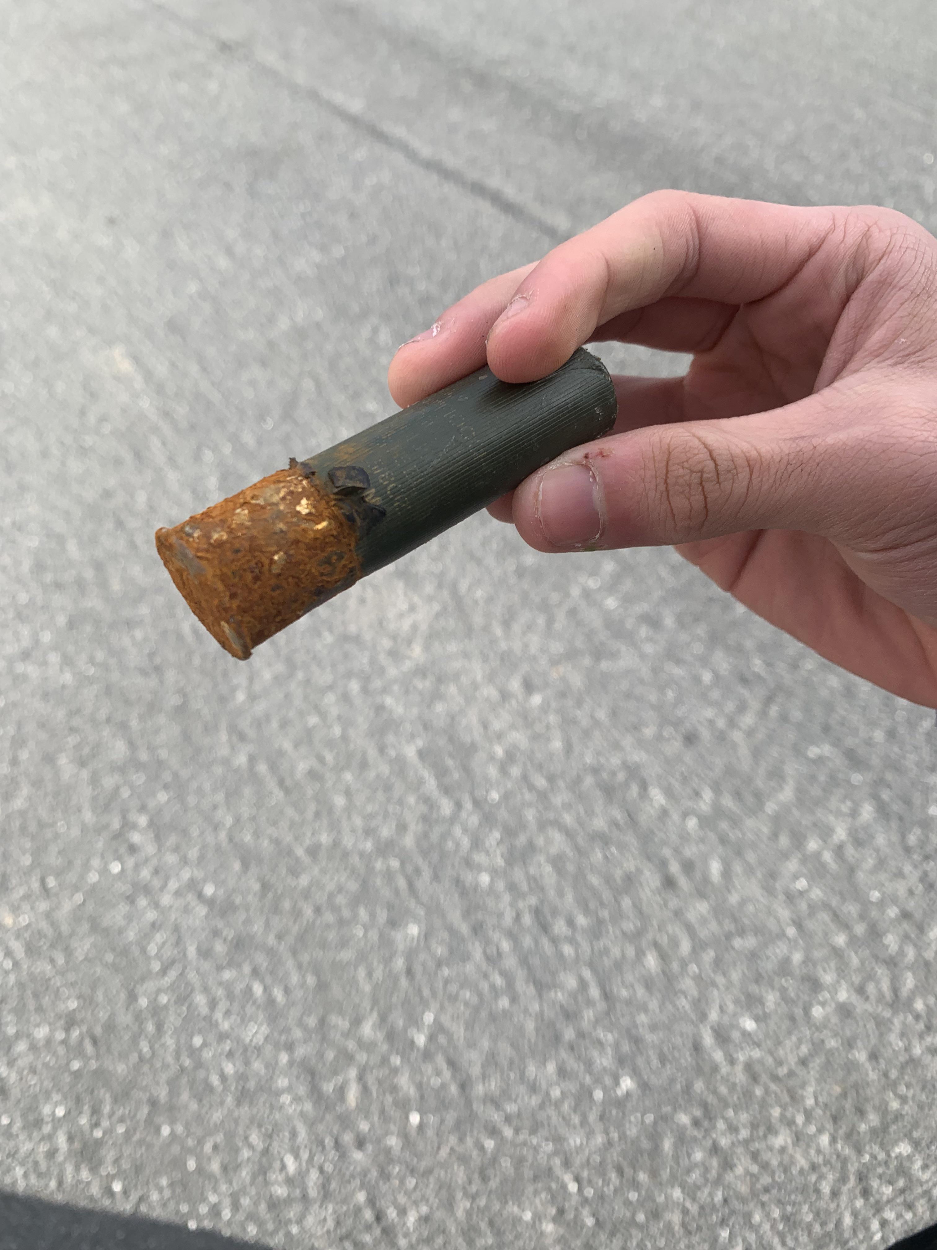 Came across a shotgun shell at my high school bus stop. 12g buckshot, still live with gunpowder and pellets inside.