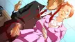 Femdom anime scene with a dominant redhead woman in a pink suit and a man in a black suit