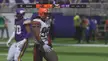 Madden 22 football players in uniforms and helmets during a blocked field goal attempt in a stadium.