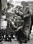GIs of the 4th Infantry Division examining some “liberated” wine in Cherbourg, France, June 1944.