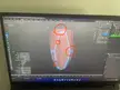 Blender software 3D model with uneven stretched bevels highlighted by red circles on a laptop screen