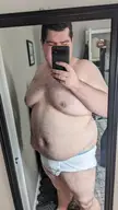 Obese white man with a fat belly taking a mirror selfie in white Hanes briefs