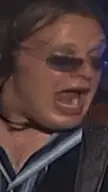 Guitar meme of a man with long hair and sunglasses singing passionately into a microphone on a dark stage.