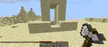 Minecraft survival build of a nether portal in a sandy desert with sandstone mountains and a diamond pickaxe
