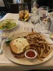 A classic Croque monsieur with a side of fries and salad. My favorite fork and knife sandwich