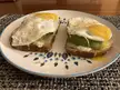 Avocado, cream cheese, swish cheese, egg sandwich. Sprinkled with garlic salt.