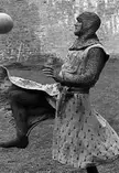 John Cleese taking a break on the set of Monty Python and the Holy Grail (1975)