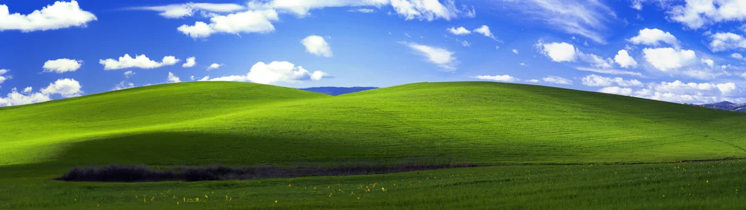 Made an extended dual monitor Bliss from windows XP using Dall-E 2 ...