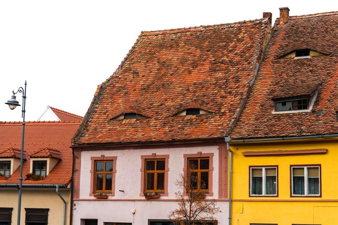 The iconic watchful eyes rooftops of Sibiu, Transylvania, Romania ...