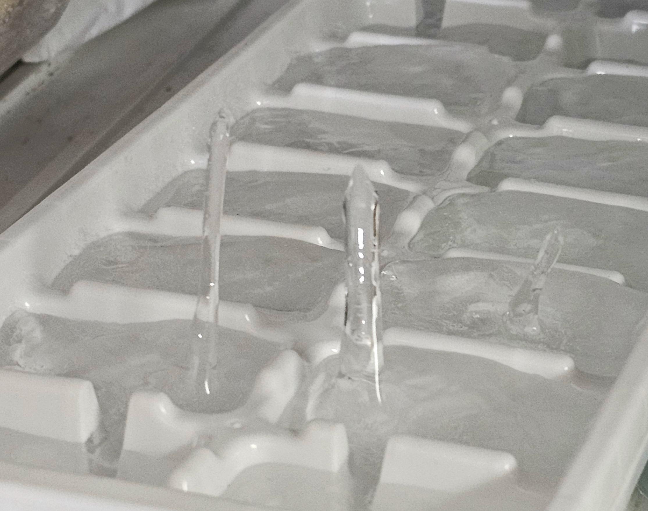 Frozen geysers grow up from ice tray