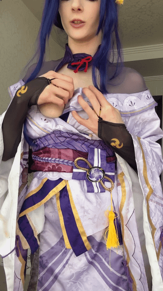 Kumi in a Raiden Shogun cosplay from Genshin Impact pulling open her outfit to flash her breasts