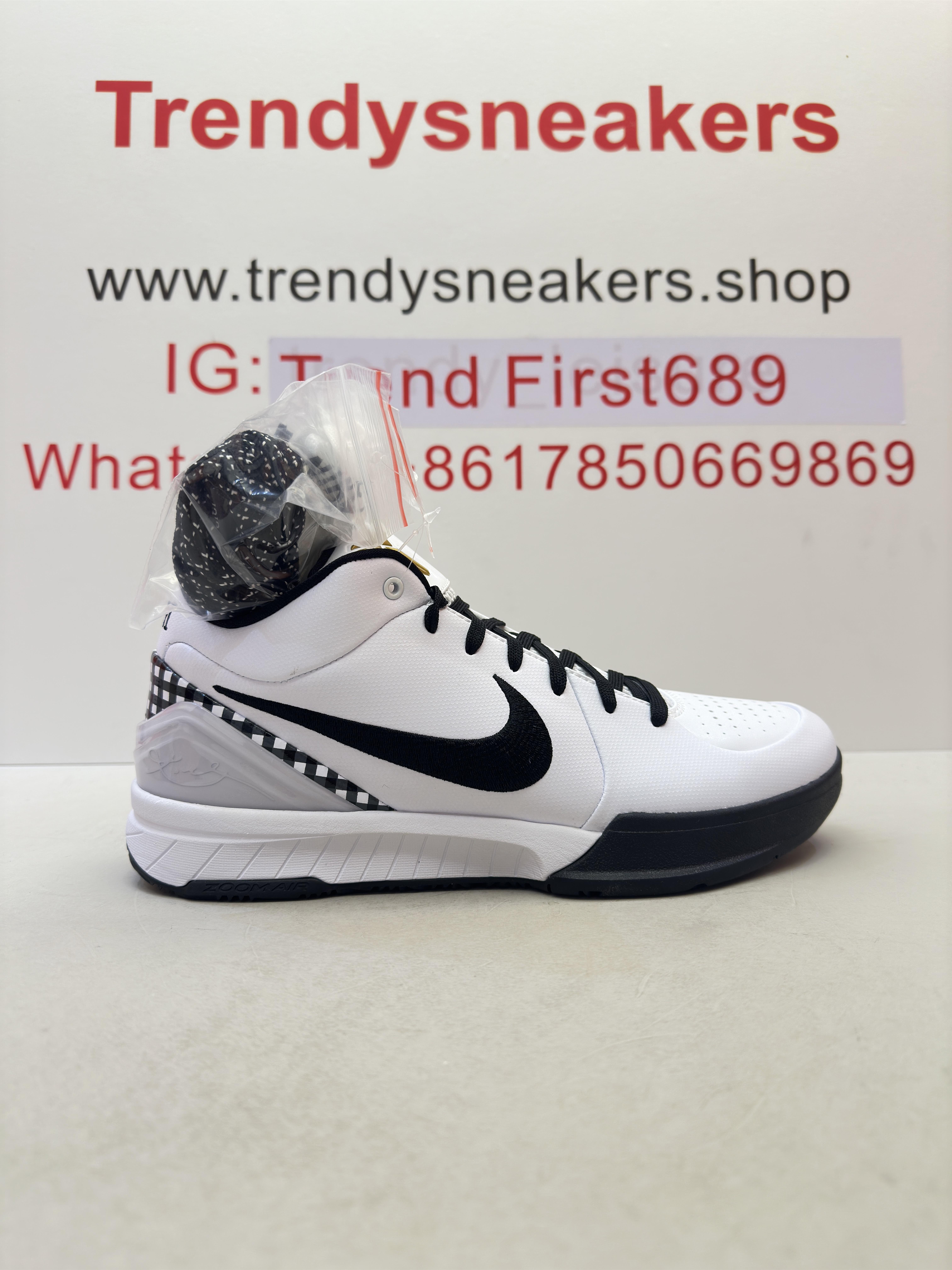 Nike Zoom Kobe 4 Protro "GIGI" sneakers with shoe box and extra laces on a white surface