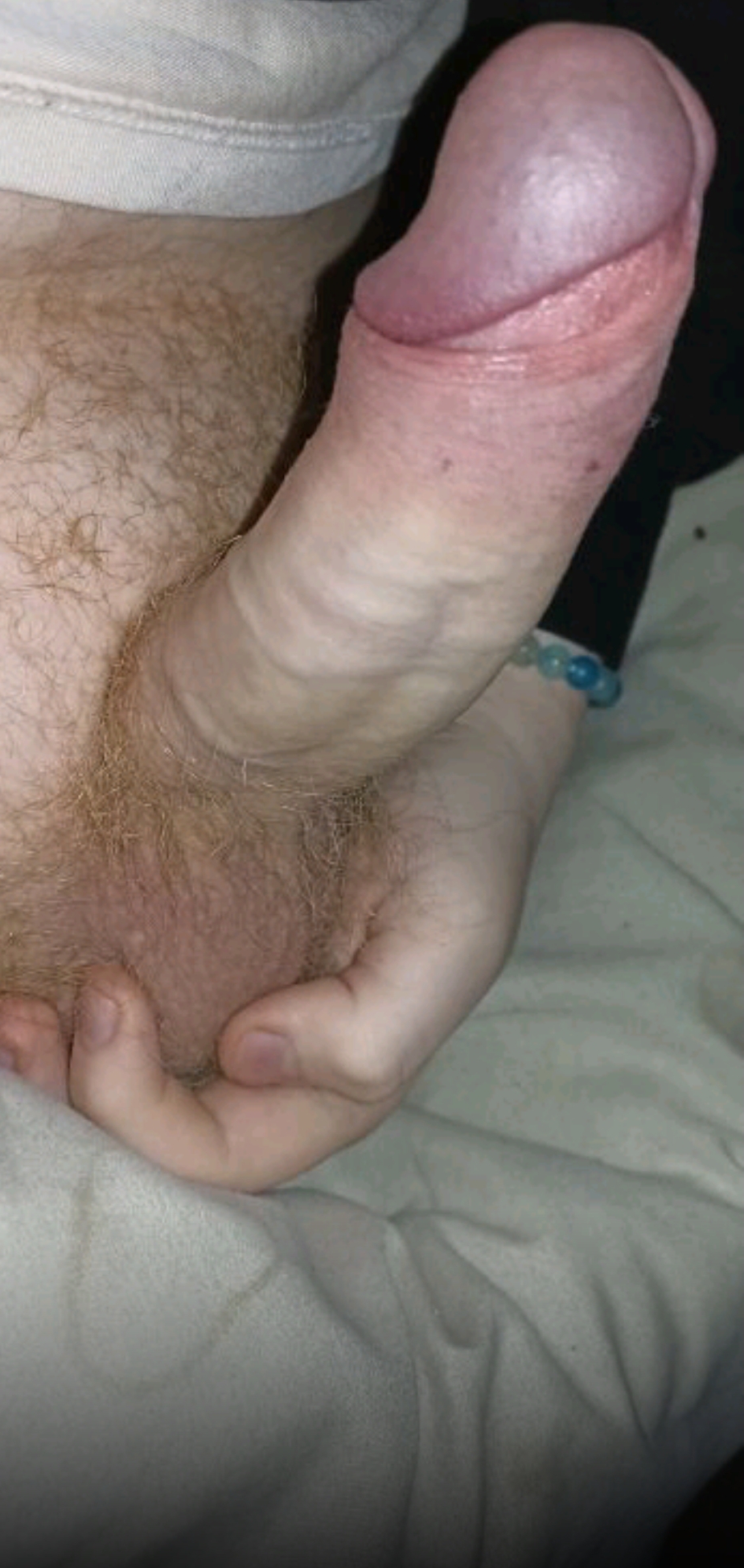 White man in white underwear holding and displaying his uncut penis in a selfie.
