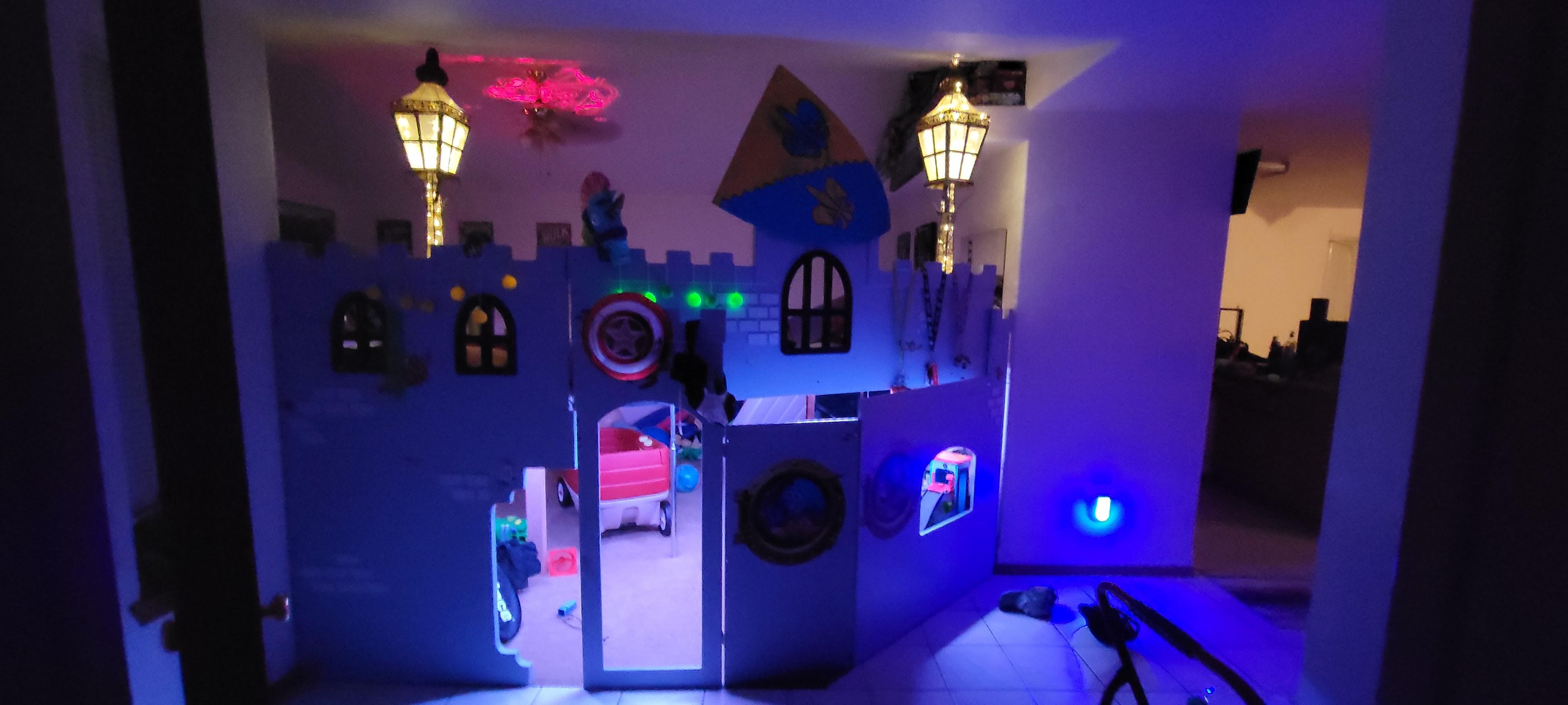 Child's bedroom in Lacey, WA featuring a custom castle bed, lamps, pillows, and stuffed animals.